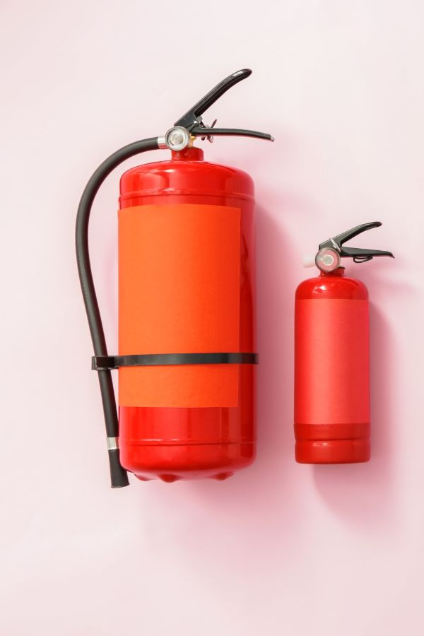 image of two fire extinguishers in varying sizes