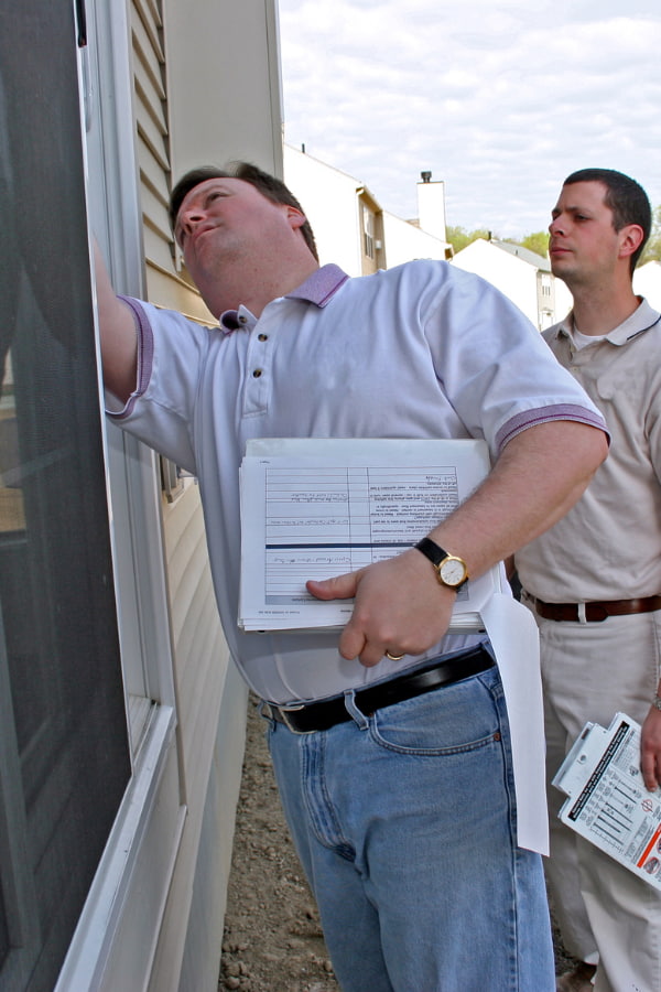 image of professionals assessing water damage